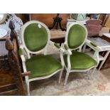 A pair of painted French style elbow chairs, width 60cm, depth 44cm, height 100cm