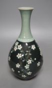 A Korean celadon ground floral decorated bottle vase, 20.5cm