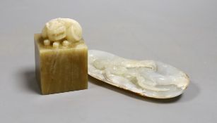 A Chinese hardstone seal and a luohan carving, 13cm tall, (2)
