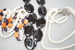 A double strand freshwater pearl necklace, with marcasite set clasp, a banded black agate necklace