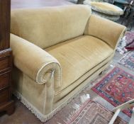 An early 20th century drop arm Chesterfield settee upholstered in gold dralon, operating handle with