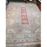 A Caucasion style polychrome geometric carpet, 360 x 260cm