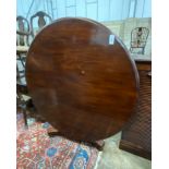 An early Victorian mahogany circular tilt top breakfast table, diameter 140cm, height 72cm