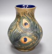 A Moorcroft pottery vase, decorated with the "Peacock feathers" pattern, 15.5cm