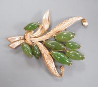 An 18k yellow metal and eight stone cabochon jade set floral spray brooch, 57mm, gross weight 11.1