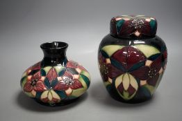 A Moorcroft pottery squat shaped vase and lidded ginger jar, decorated in the "Orchid Trillium"