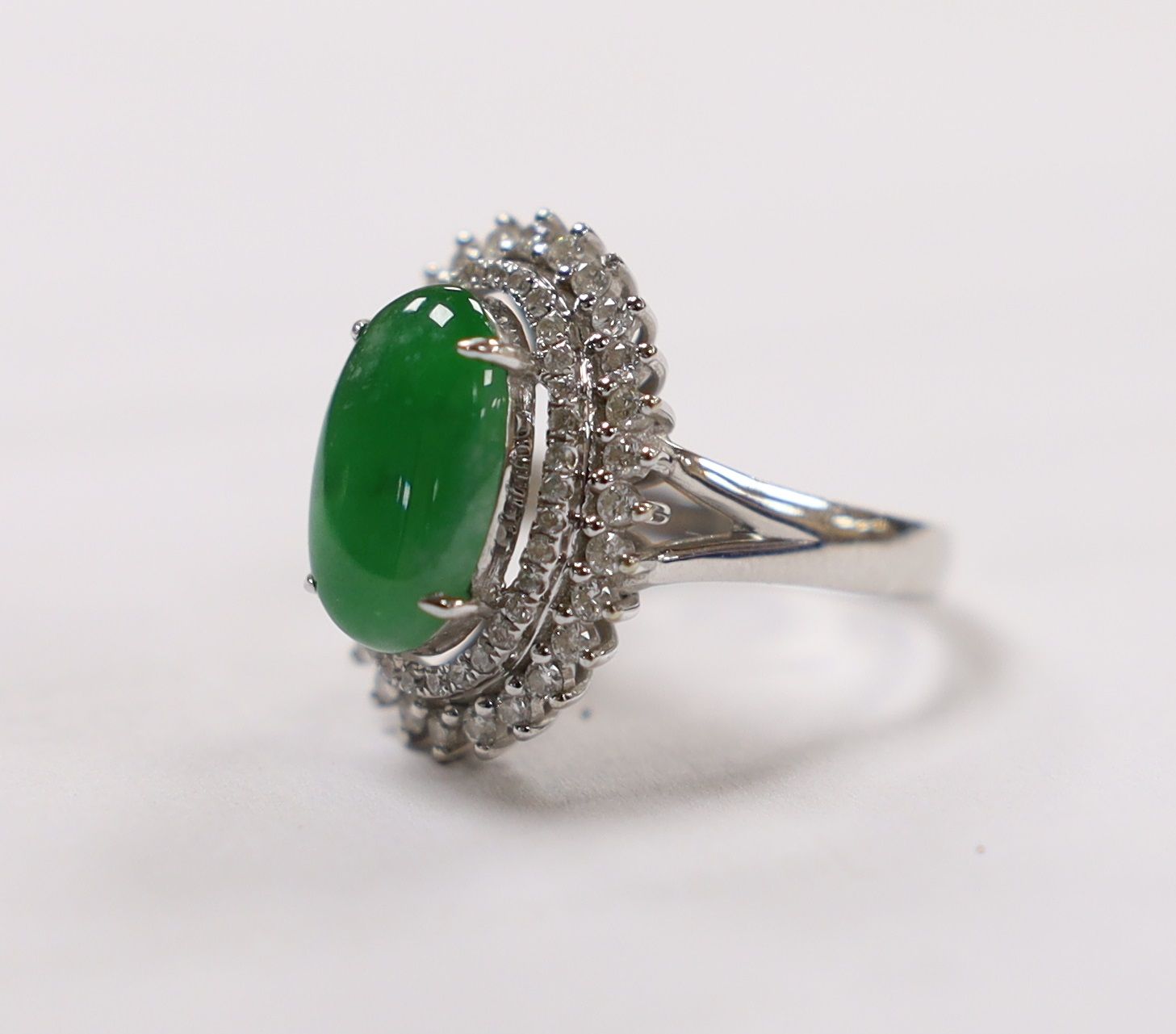 A modern 18k white metal, cabochon jade and two row diamond chip set oval cluster ring size L, gross - Image 3 of 8