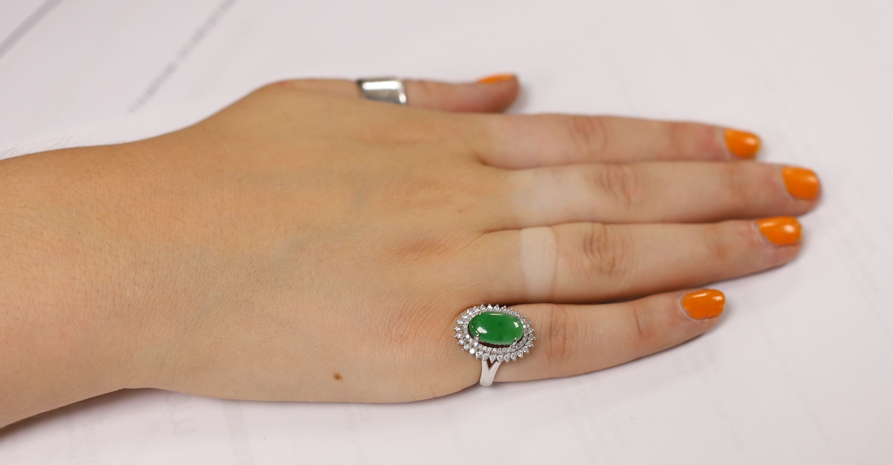 A modern 18k white metal, cabochon jade and two row diamond chip set oval cluster ring size L, gross - Image 7 of 8