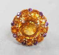 A large 14k, citrine and amethyst cluster set flower head dress ring, with diamond chip set
