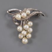 A modern 14k and graduated eleven stone cultured pearl cluster set brooch, 40mm, gross weight 7.4