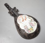 A Chinese wall model of a musical string instrument (Pipa?) with painted porcelain inset, 27cm long