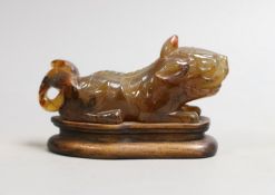 A Chinese agate recumbent lion dog 13cm long