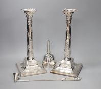 A pair of silver plated candlesticks, a plated wine funnel and a plated candle extinguisher,Plated