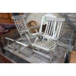 A pair of weathered teak garden steamer chairs (both a.f.)