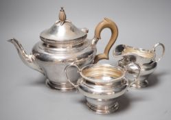 A George V silver inverted pear shape three piece tea set, Edward Barnard & Sons Ltd, London 1928/9,