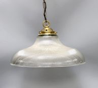 A clear ribbed glass shaded and brass pendant light,shade 37.5 cms diameter.