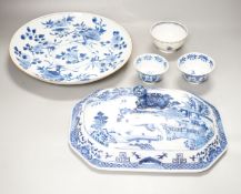 An 18th century Chinese blue and white dish, 29cm diameter, a similar lid and three tea bowls
