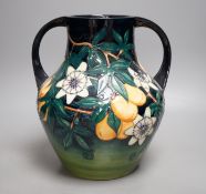 A Moorcroft pottery two handled vase, decorated with the "Passion flower" pattern, designed by