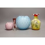 A pale blue quilted glass vase, another, smaller, in pink, a “Mary Gregory’’ vase and a yellow