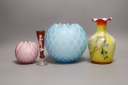 A pale blue quilted glass vase, another, smaller, in pink, a “Mary Gregory’’ vase and a yellow