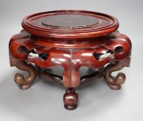 A large Chinese hardwood wood vase stand, early 20th century, 32cm diameter.Provenance - D.C.
