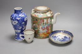 A Chinese famille rose teapot and cover, a blue and white prunus vase, a saucer and a coffee cup,