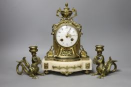 A 19th century French brass and alabaster mantel clock and a pair of dragon candlesticks,clock 28cms