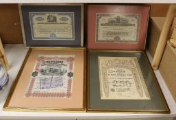 Four framed Share Certificates: one Siberian, two USA and one Spainish.
