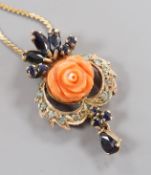 A 20th century yellow metal, carved coral, sapphire and gen set drop pendant, 32mm, on a later 750