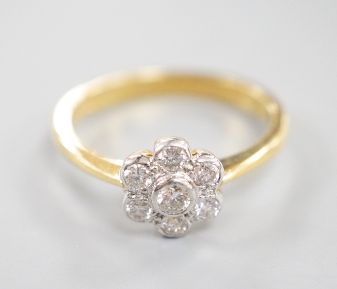 A modern 18ct gold and collet set seven stone diamond set flower head cluster ring, size O, gross - Image 2 of 4