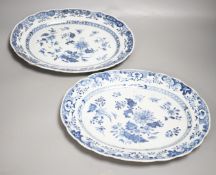 A pair of Chinese blue and white platters, decorated flowers, late 18th century, 34.5cm