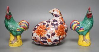 A pair of Chinese pottery roosters and an Imari quail, tallest 15cm