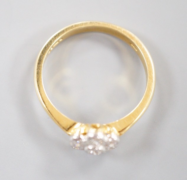 A modern 18ct gold and collet set seven stone diamond set flower head cluster ring, size O, gross - Image 3 of 4