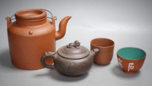 Two Chinese Yixing teapots and two similar teabowls. Tallest 14cm