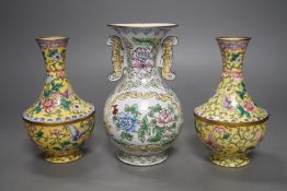 A pair of Chinese Guangzhou yellow enamel vases and another similar vase,tallest 15cms high.