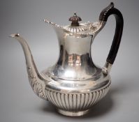 A late Victorian demi-fluted silver coffee pot, Gibson & Langman (Goldsmiths & Silversmiths Co Ltd),