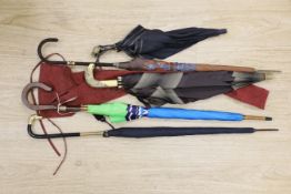 Three novelty handled umbrellas and two others,horse handled umbrella 86.5 cms long.