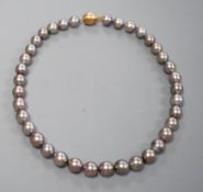 A single strand Tahitian style South Sea pearl necklace, with 585 brushed yellow metal clasp,