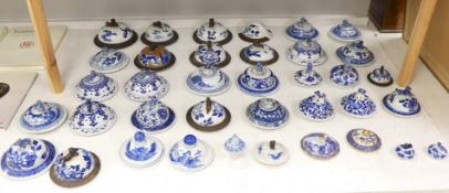 Thirty-seven 18th/19th century Chinese blue and white porcelain covers, 17cm diameterProvenance -