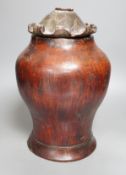 A Chinese carved wood jar and cover, 33cm