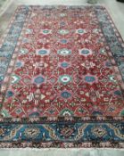 A Hamadan red ground carpet, 332 x 242cm