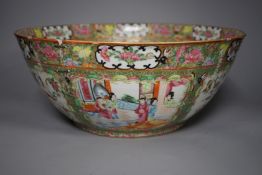 A 19th century Chinese famille rose punch bowl, painted with figures, 34.5 cm diameter, repaired