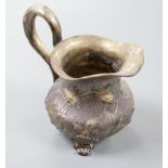 A 19th century Russian gilt white metal cream jug, indistinct marks, 94mm, 109 grams.