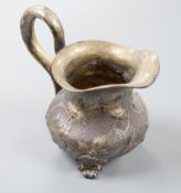 A 19th century Russian gilt white metal cream jug, indistinct marks, 94mm, 109 grams.