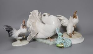 A Herend model of a rabbit, a pair of Rosenthal porcelain models of cockerels and a porcelain