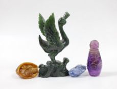 A Nephrite carving of a reading phoenix, 13cm tall, and three other carvings (4)