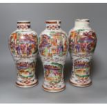 A set of three Qianlong famille rose baluster vases, 24.5cm tall