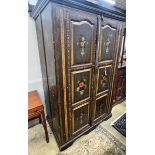 An Indian painted hardwood two door cupboard, width 120cm, depth 70cm, height 185cm