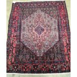 A North West Persian blue ground rug 142cm x 117cm.