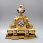A 19th century French gilt metal and Sevres style enamel mantel clock, 37cm wide